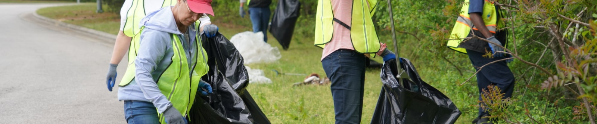 Volunteers collecting litter and debris during creek week litter sweep