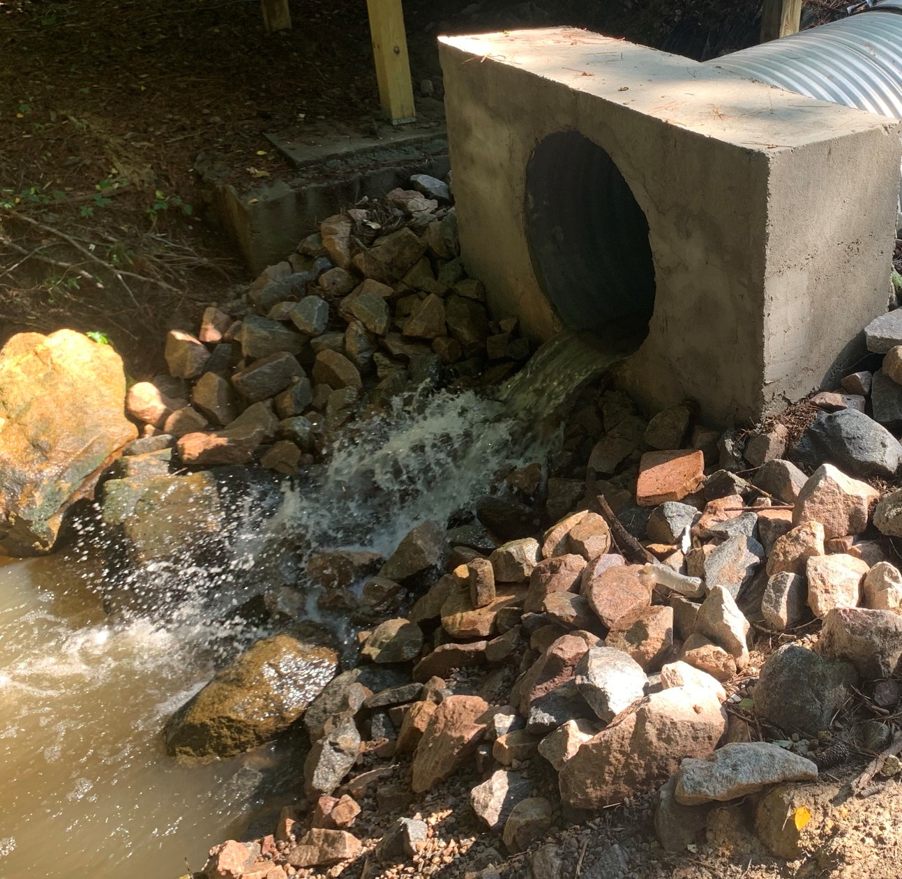 Stormwater discharging into stream.