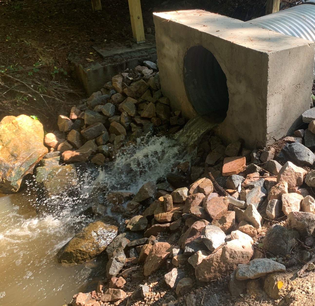 Stormwater discharging into stream.